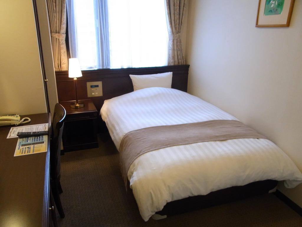 Amami Sunplaza Hotel Номер фото